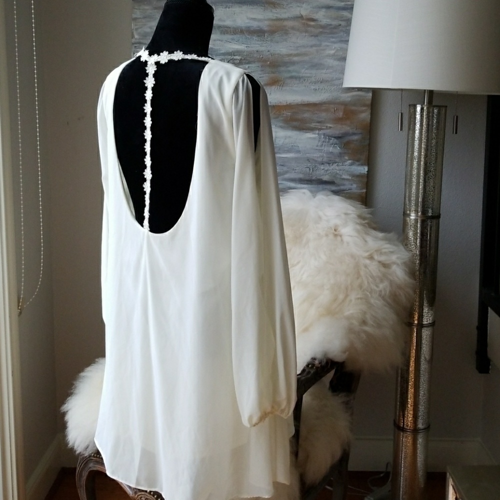 Open shoulder dress with T detail on back.